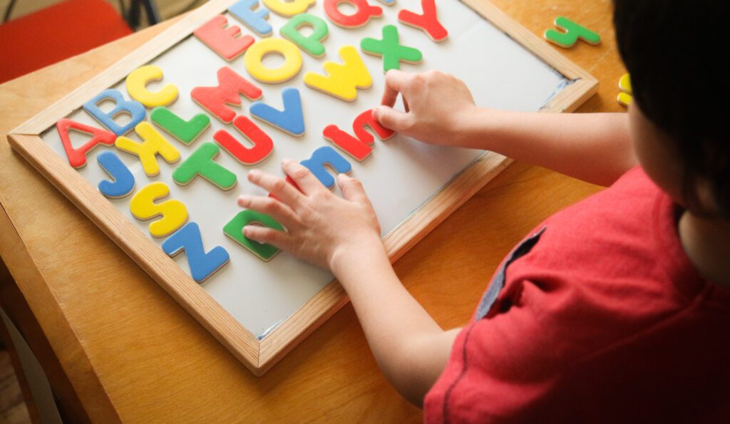 Kid Is Learning The Alphabets At Home